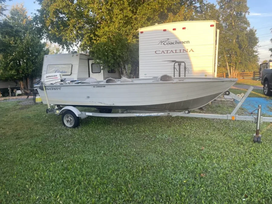 16′ Canadian 25hp Johnson and galvanized trailer