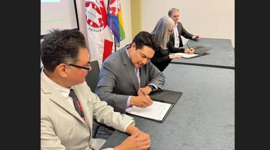 narcisse-fox-signing Deal For Education Reset Table Inked