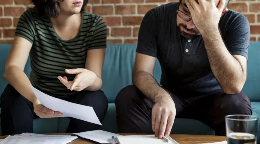 debt-paperwork-couple-frustrate-istock More Canadians picking up second jobs to combat debt
