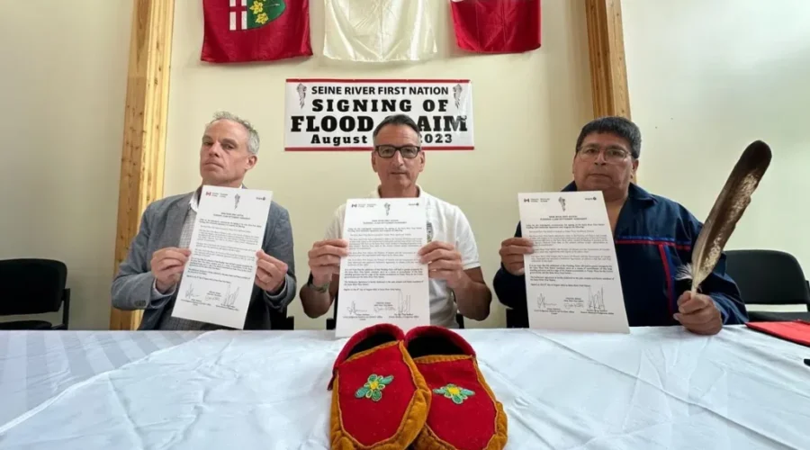 rickford-seine-signing-twitter $125 million settlement for flooded First Nation