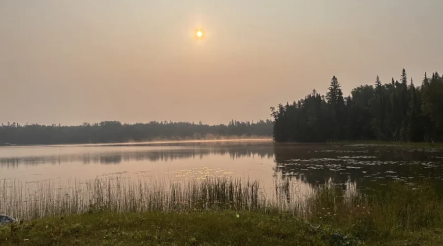 Smokey Sunrise over Forest Lake