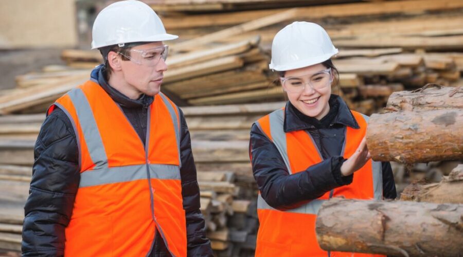 Forestry workers looking at logs Forest Products Association of Canada Oct 2025 Forest industry seeks equal attention in U.S. trade talks
