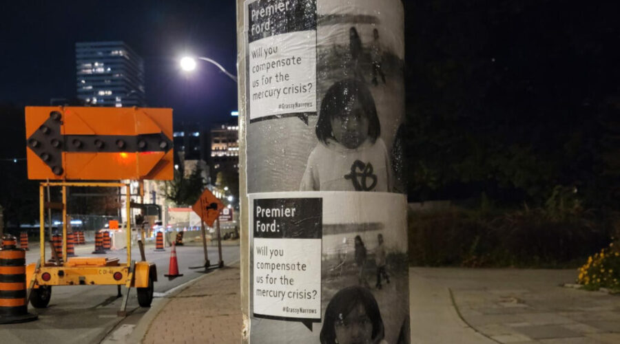 Posters plastered near Queen’s Park calling for Grassy Narrows justice