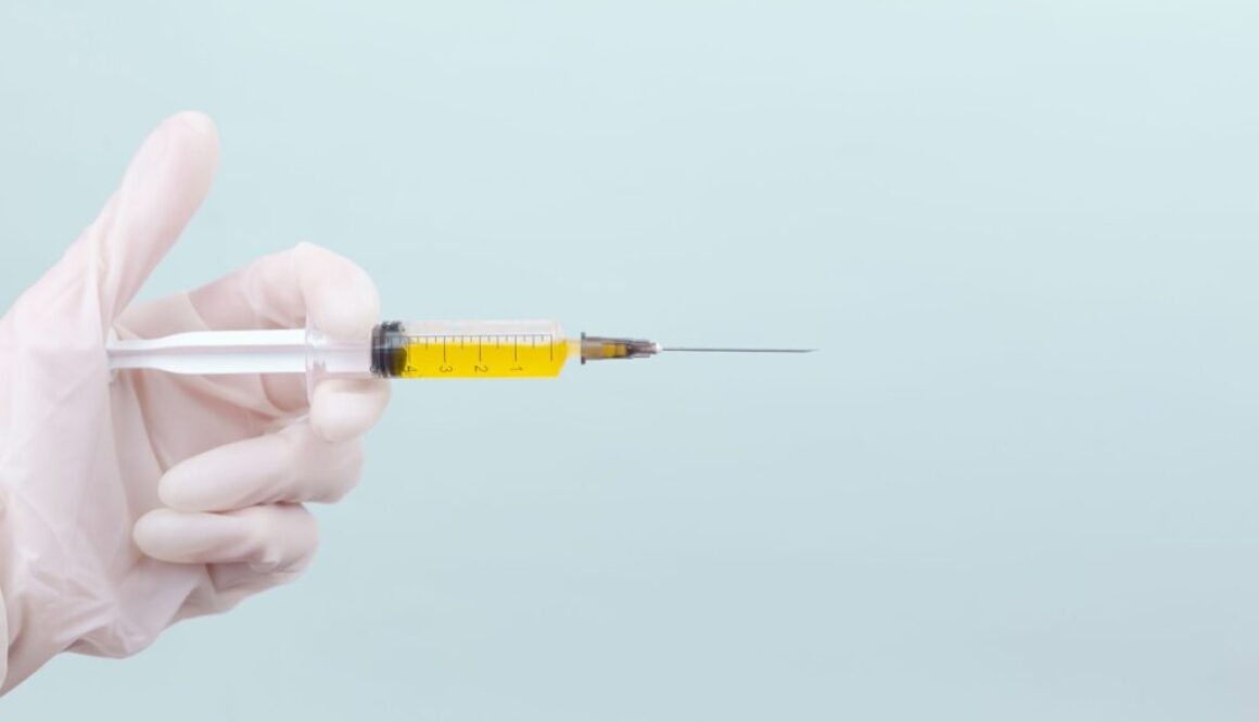 person holding yellow and white pen