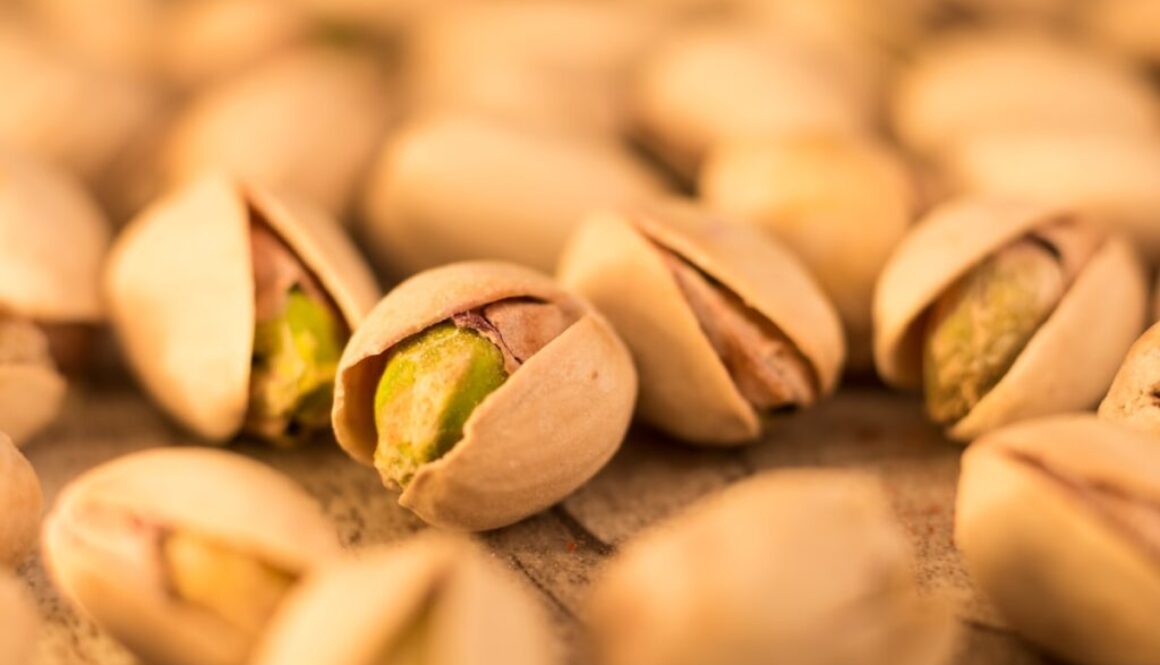 a pile of pistachio nuts sitting on top of a table