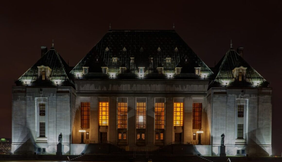 white and brown concrete building during night time