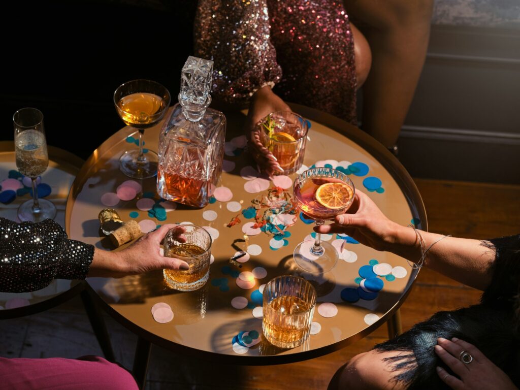 a group of people sitting around a table with drinks