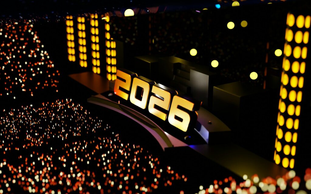 Stage with "2026" illuminated, audience in dark
