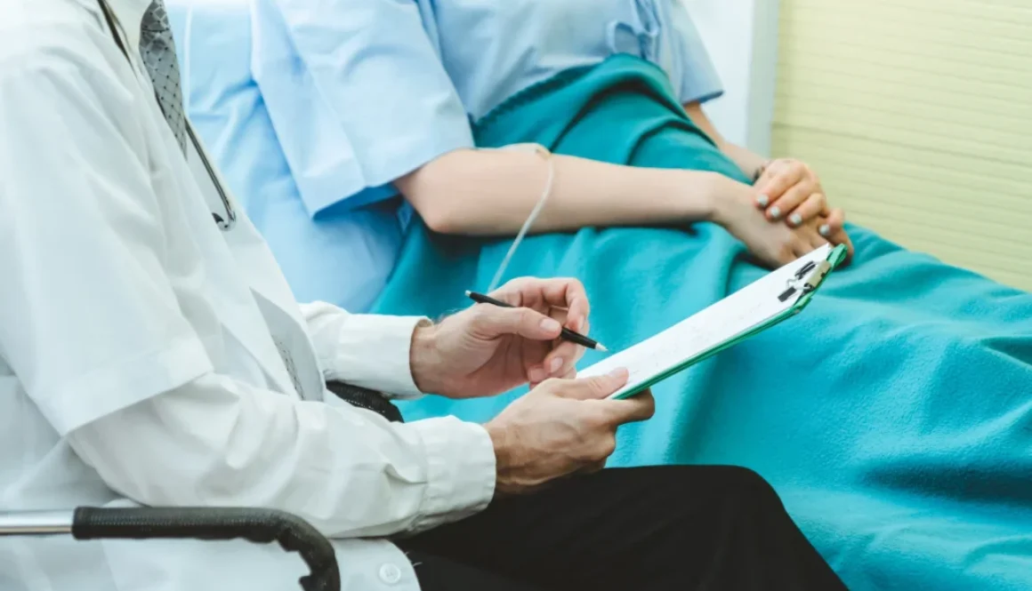 Doctor in professional uniform examining patient at hospital or medical clinic. Health care , medical and doctor staff service concept.