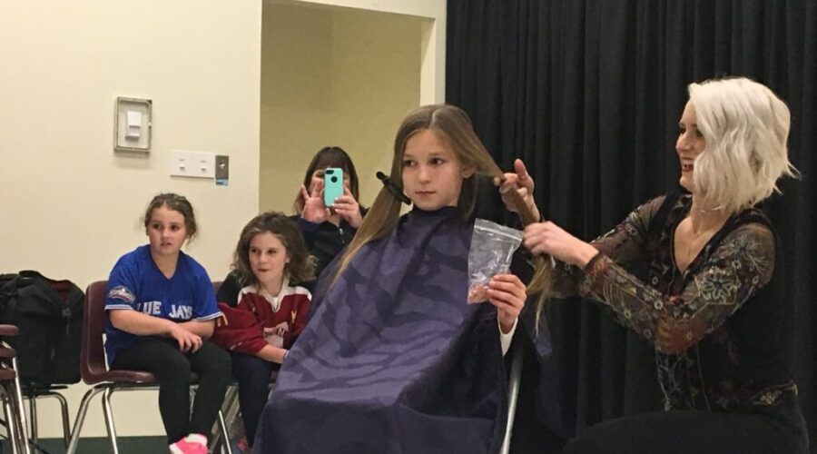 New Prospect Student Cuts Hair For Dryden CT Scan Unit