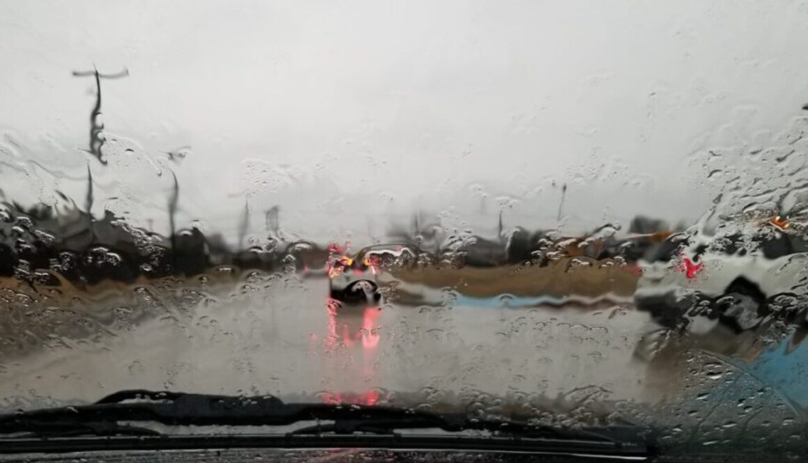 vehicle running on road during rainy