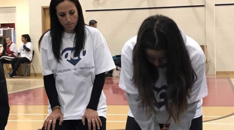 High School Students Receiving CPR Training