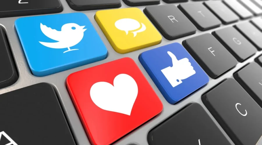 Social media on laptop keyboard. Proposed bill would ban under-16s from social media