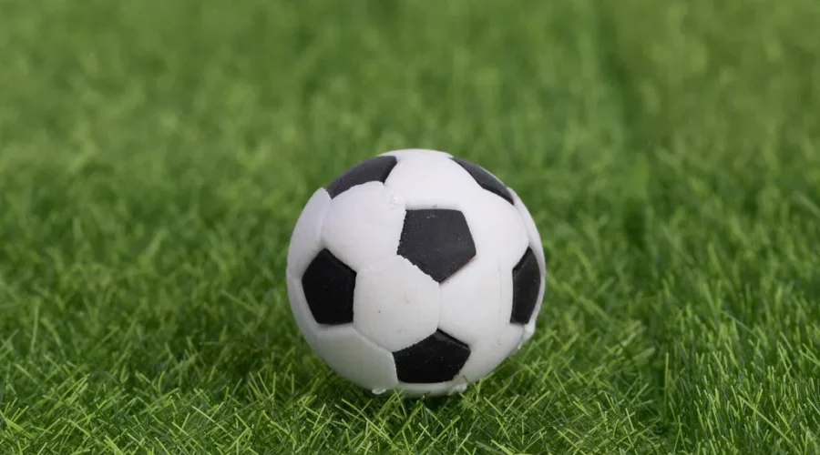 Football soccer ball on grass field Canada ties first game at the World Cup of Soccer